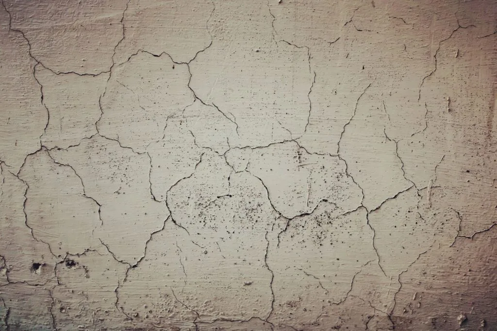 Cracked concrete surface showing the kind of damage repair and resurfacing corrects